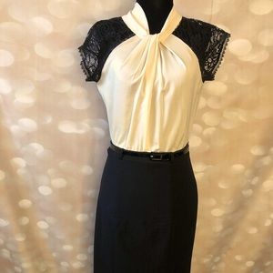 Elegant dress with lace details and belt